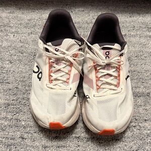 On Running Cream and Orange Athletic Shoes